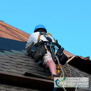 Roofers Setting Asphalt Shingles on Roof in Brossard